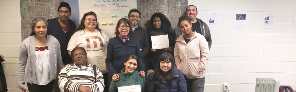 trainer gives diploma to group